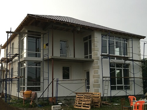 Отделка фасада дома штукатуркой в Марьиной Горке